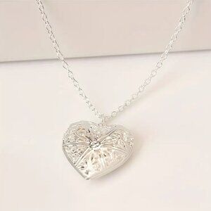 Elegant Heart-Shaped Hollow Metal Photo Locket Necklace. Sterling Silver.